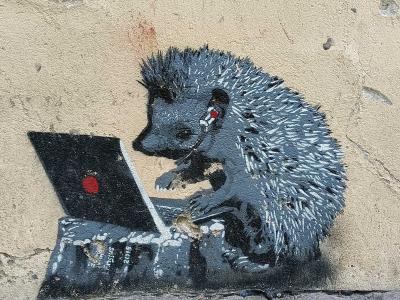 Hedgehog working on laptop — Street art by Edward von Lõngus in Vilnius