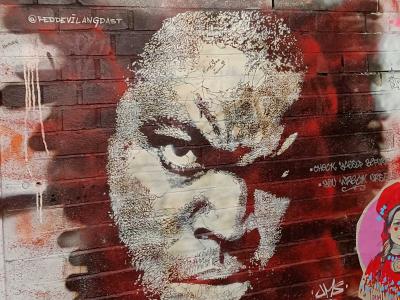 Portrait with Intense Gaze — Street art by Reddevilangdast in Berlin