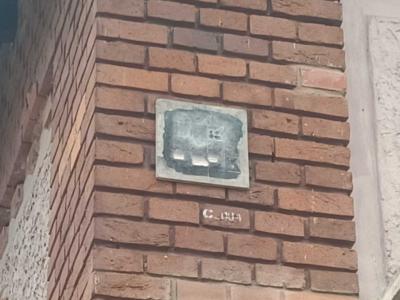 Concrete Relief on Brick Wall — Street art by Pavel Dušek in Prague