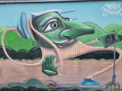 Stylized Green Creature — Street art in Le Pont-de-Claix