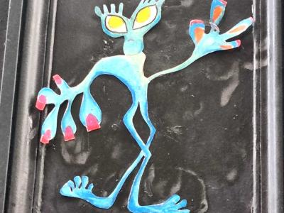 Blue Yellow-Eyed Alien — Door Collage — Street art in Clermont-Ferrand