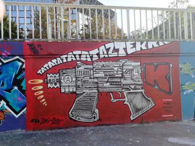 Machine Pistol on Red — Street art in Nantes
