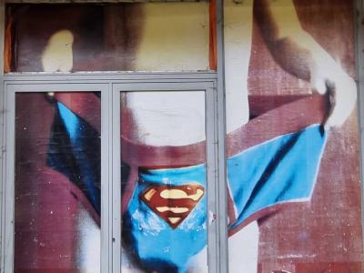 Superman Revealed in Storefront — Street art in Clermont-Ferrand