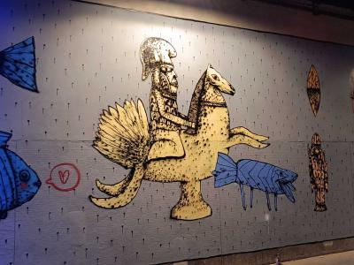 Knight Riding Winged Creature with Blue Fish — Street art in Paris