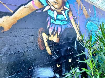 The Girl with the Black Cat — Street art in Vallon-Pont-d'Arc