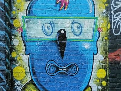 Tête bleue aux lunettes vertes — Street art de Cranio à London