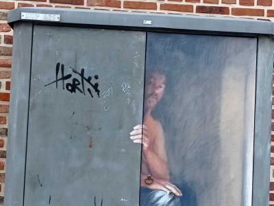 The Bare-Chested Man Painted on the Cabinet — Street art in Amiens
