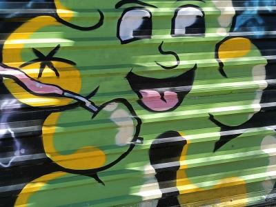 Green Cartoon Character with Spray Can — Street art in Madrid