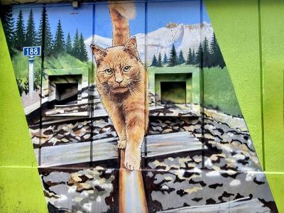 Ginger Cat Walking on Alpine Rails — Street art in Grenoble