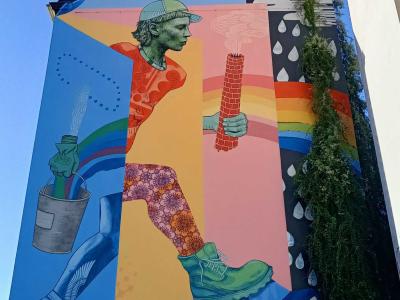 Colourful Figure with Paint Bucket, Berlin — Street art by Various & Gould in Berlin