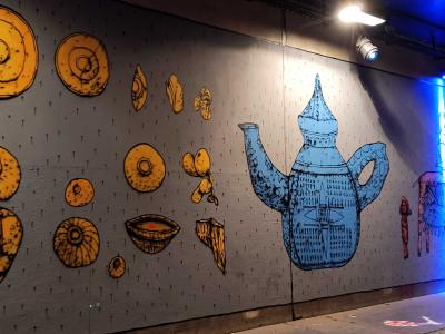 Mural with Blue Teapot and Golden Shapes — Street art in Paris