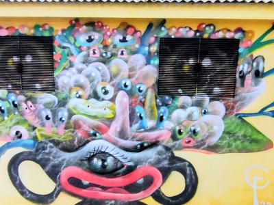 Festive Multicolor Creature — Street art in Saint-Paul