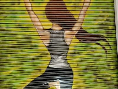Yoga Dancer on Rolling Shutter — Street art in Madrid