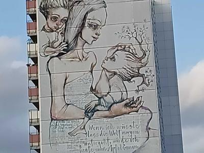 Figures and handwritten text — Street art by Herakut in Berlin