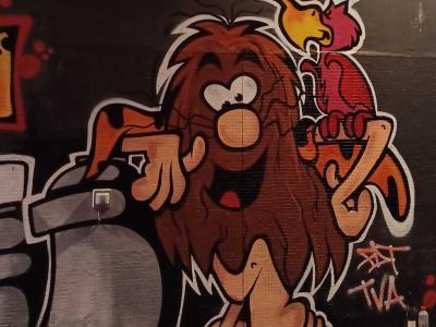Cartoon Lion with a Parrot — Street art in Paris