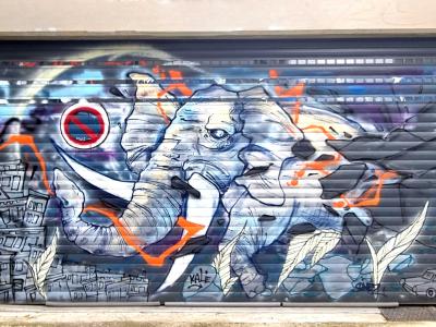 Elephant in Motion on Metal Shutter — Street art in Grenoble
