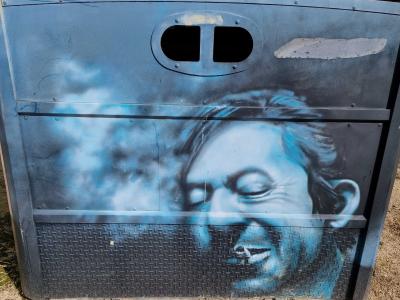 Blue Face on a Glass Bank — Street art in Clermont-Ferrand