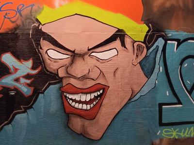Cartoon Portrait with Demonic Smile — Street art in Paris