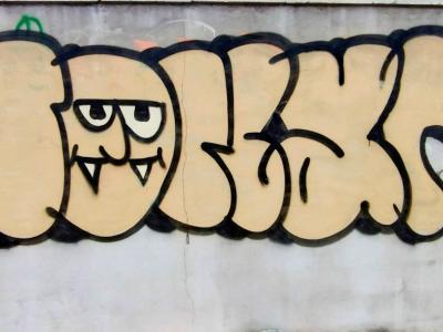 Fanged Monster in Bubble — Street art in Saint-Paul