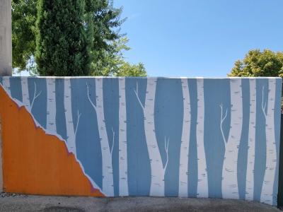 Birches on the blue wall — Street art in Vallon-Pont-d'Arc