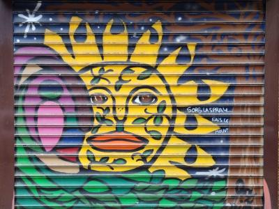 Yellow Door Mural with Stylized Head Large Mouth — Street art in Grenoble