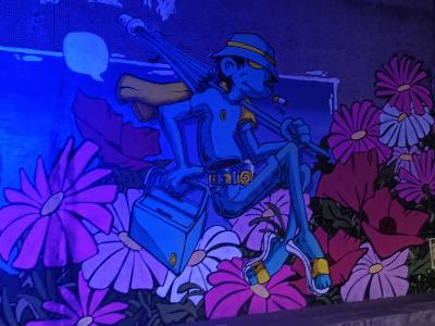 Cycling Robot Among Flowers — Street art in Paris