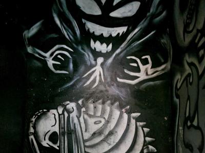 The Demon above the Skeleton — Street art in Grenoble