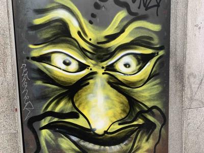 Yellow-Green Troll Face — Street art in Madrid