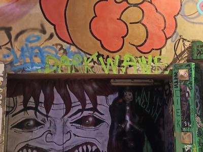 Cartoon Duel Between Funky Character and Dark Monster — Street art in Paris