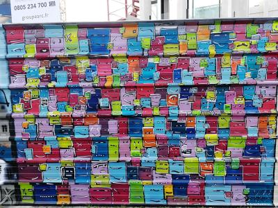 Wall of Colorful Faces — Street art in Nantes