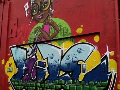 Girl with Turban and Blue Lettering — Street art in La Rochelle