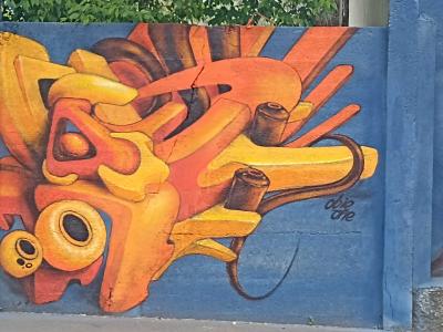 Orange volume on a blue wall — Street art in Budapest