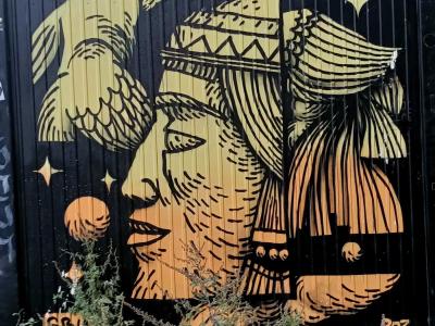 Duo of Golden Tribal Faces on Black Background — Street art by Sbuone in Berlin