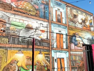 Animals in a Library Cafe — Street art in Rīga
