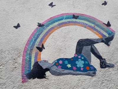 Girl Under Rainbow with Black Butterflies — Street art in Clermont-Ferrand