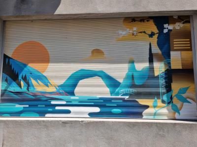 The Pont d'Arc on the roller shutter — Street art in Vallon-Pont-d'Arc