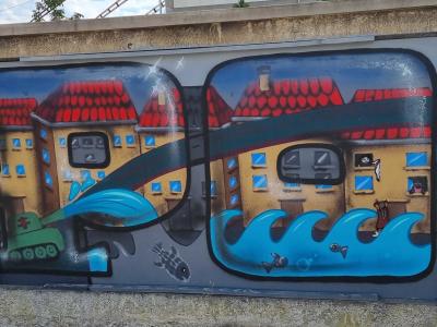 Scène urbaine avec tank et vagues bleues — Street art à Strasbourg