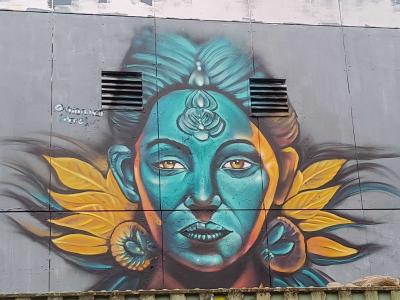 Blue Goddess with Golden Leaves — Street art by Giancarlo Ayasta Bernabe in Berlin