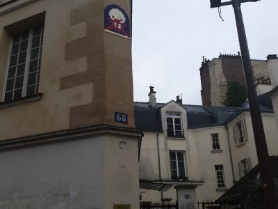 Red Figure Under a White Dome — Street art in Paris