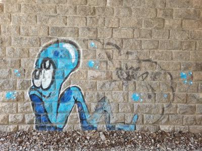 The seated blue character — Street art in Le Mayet-d'École