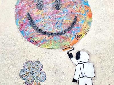 The Astronaut Painting a Smiley — Street art in Clermont-Ferrand