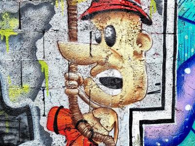 Climber in a Red Hat — Street art in Grenoble