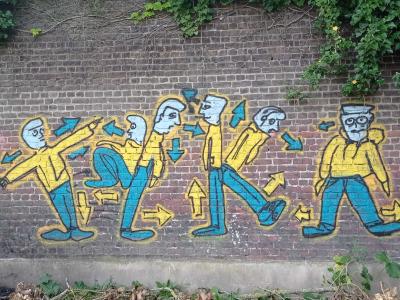 Frieze of men and arrows — Street art in Roubaix
