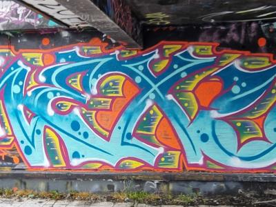 Cyan wildstyle under the bridge — Street art in Grenoble