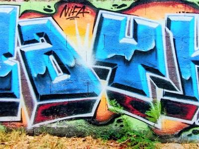 Stylized Blue Letters — Street art in Saint-Paul