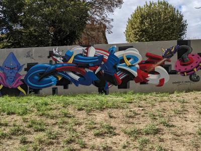 Blue and Red Piece with a Purple Wizard — Street art in Sérignan