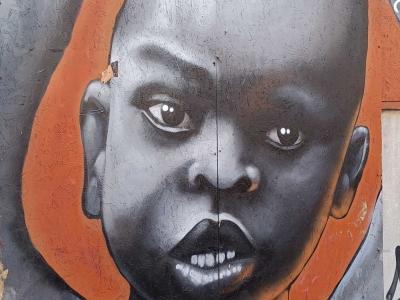 Monochrome Portrait with Orange Accent — Street art in London