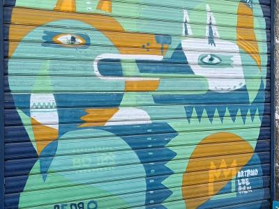 Two Animal Heads on a Shutter — Street art in Nantes