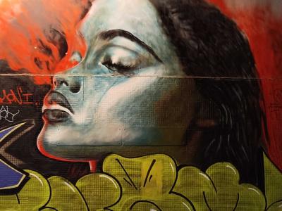 Realistic Female Portrait with Flames — Street art in Paris