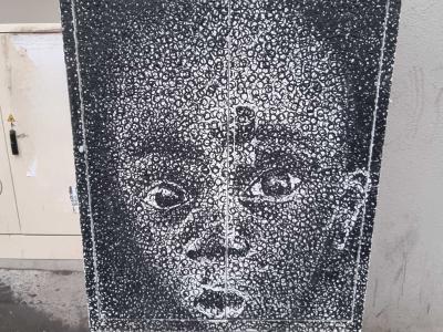 Child Portrait in Pointillism — Street art in Strasbourg